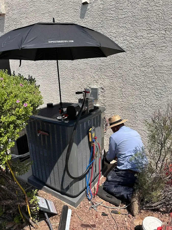 HVAC technician performing outdoor AC maintenance in Atlantic City